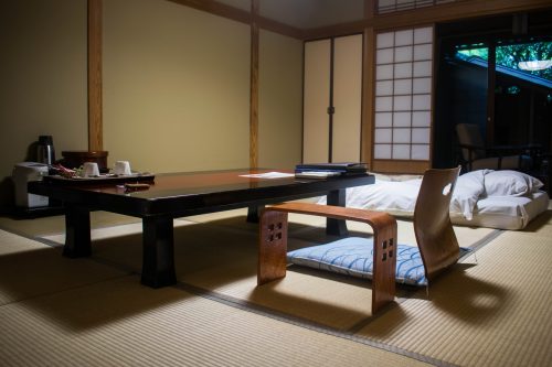 Coffee table and futon in one of Tanokura ryokan rooms in Yufuin, Oita prefecture, Japan