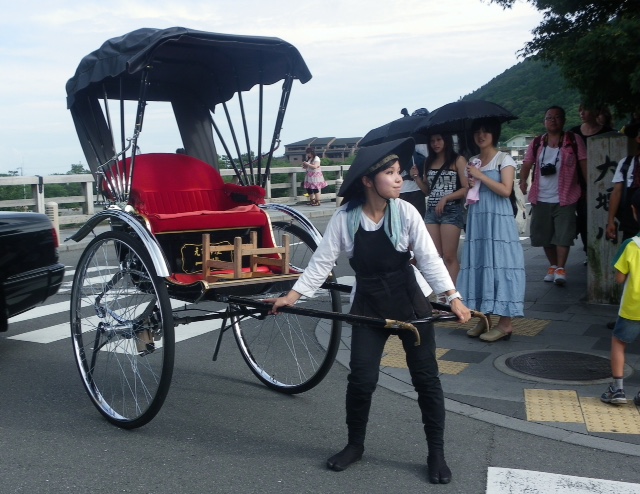 a rickshaw/taxi functions as form of transport to get you around Senso-ji temple in Asakusa.