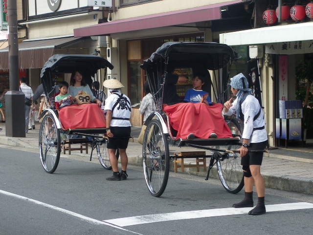 a rickshaw/taxi functions as form of transport to get you around Senso-ji temple in Asakusa.