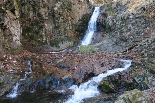 The waterfall at Tyouji Falls, rounded by a hiking path as one waterfall among many around Nikko