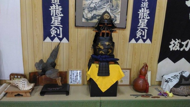 various samurai artefacts displayed in a Battodo dojo