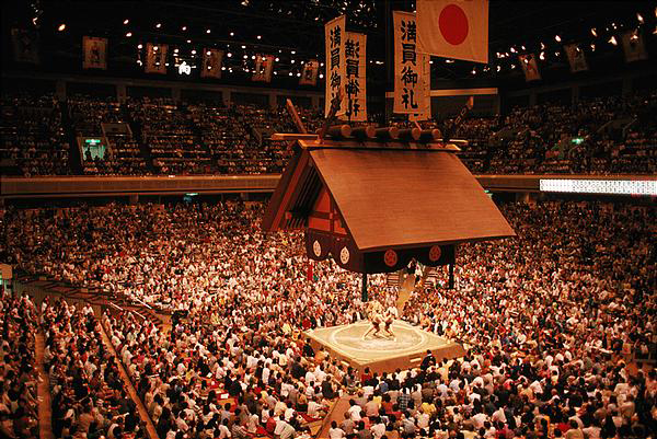 huge crowds gather to see the sport of Sumo tournaments in Japan