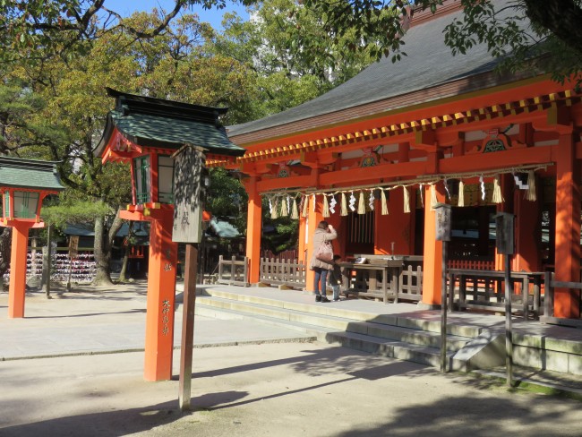 Sumiyoshi shrine stands orange within a green nature found amidst otherwise bustling Hakata, Fukuoka