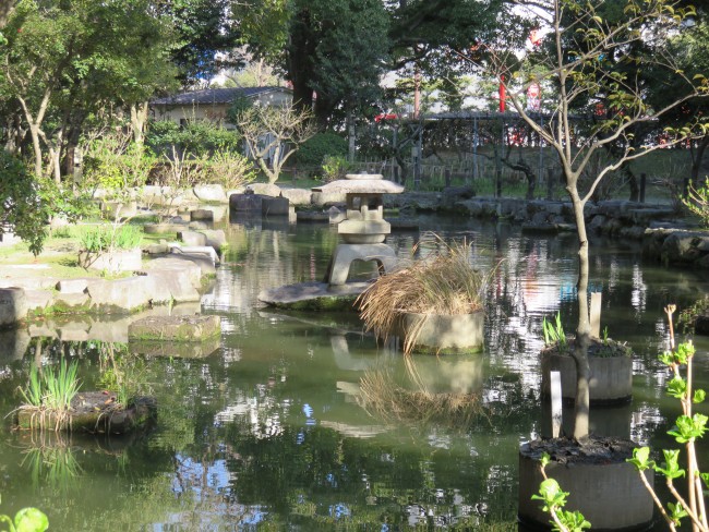 Sumiyoshi shrine pond within nature amidst otherwise bustling Hakata, Fukuoka