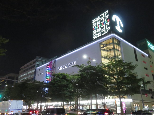 See the shops and bright lights of Tenjin, Fukuoka