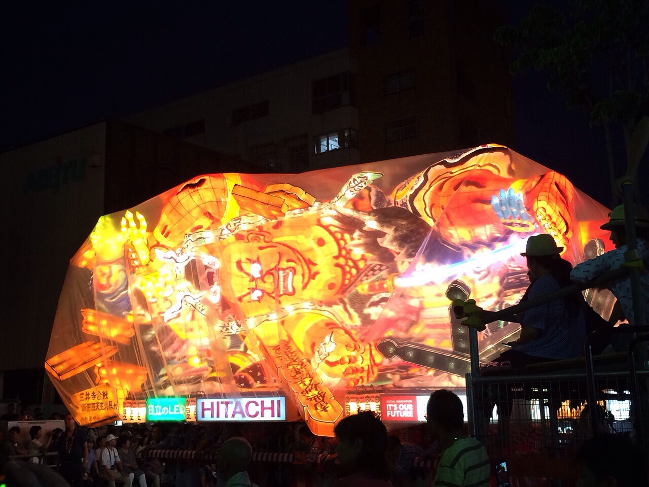 A colorful glowing float at the Nebuta Matsuri Festival.