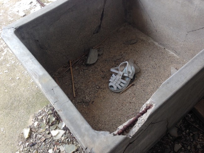 Shoe in a concrete box at Matsuo Kouzan town.