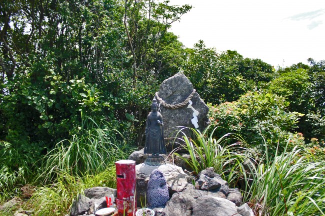 Central peak of Kinpo Mountain where you find a small shrine like area of rocks and a small staute.