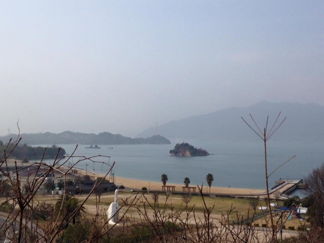 Break from cycling, looking at an island dinosaur looking towards mainland Hiroshima