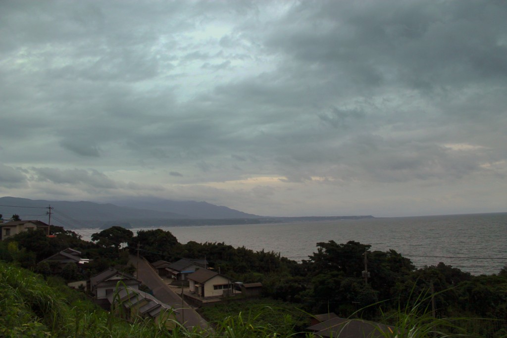 Houses of Sakurajima with nature of the island and water in surrounding.
