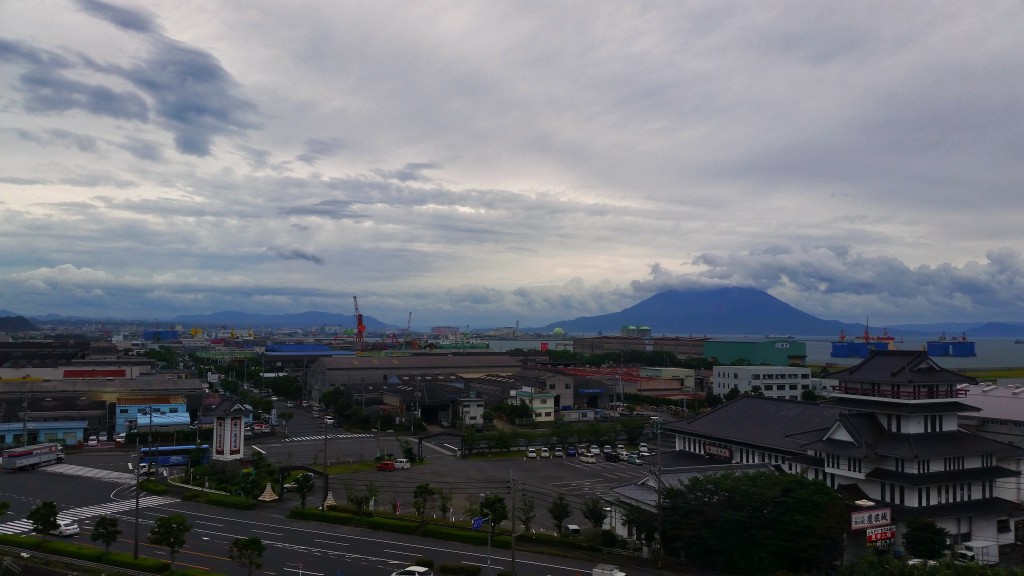 City scenery with a little nature on the island of Sakurajima with the volcano in the background.