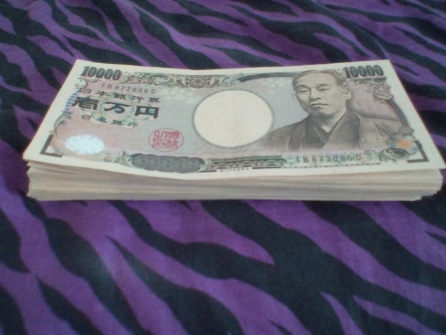 stack of yen obtain at the ATM , Japan's currency.