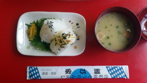 Rice balls, miso soup and chopsticks in somen noodles shop of Ibusuki.