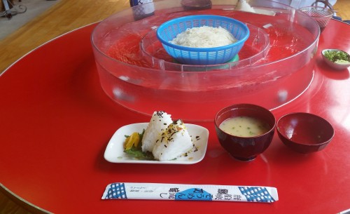 Rice balls, miso soup and chopsticks in somen noodles shop of Ibusuki.