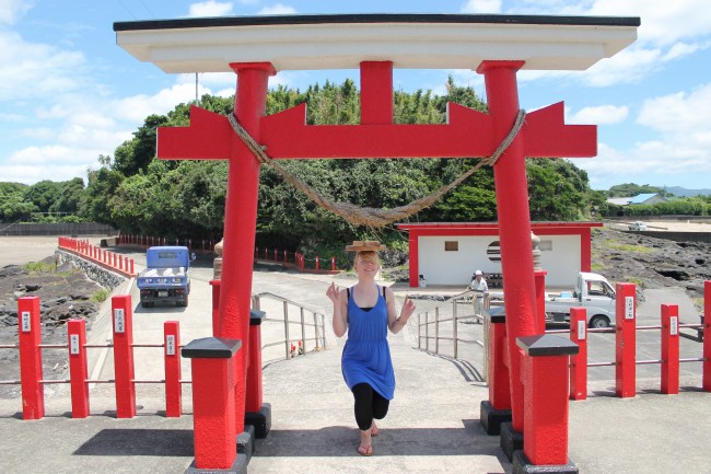 Person near the gate with the lid on her head at Kamafuta Jinja in Kagoshima. Almost there.