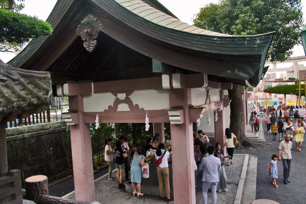 Shrine cleaning station at Rokugatsudo festival in Kagoshima.