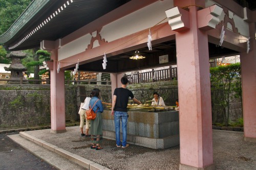 Shrine cleaning station at Rokugatsudo festival in Kagoshima.