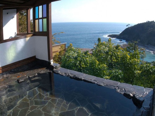 outdoor hot springs / onsen in hotel with a view of the sea