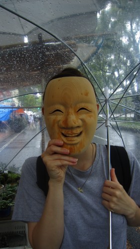 A wooden mask at the Kochi Sunday market.