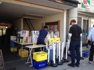Workers are setting up the stand to sell at Yoichi 