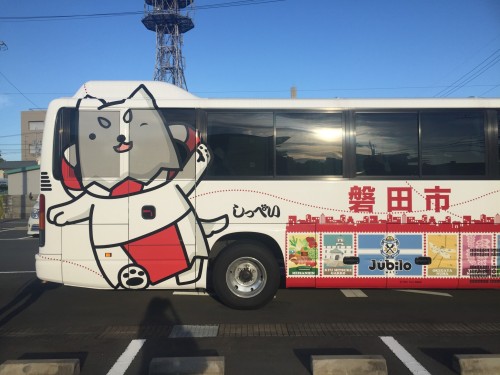 mascot character named shippei appear on the right side of bus 