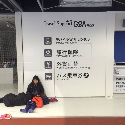 Some people slept near the baggage-weigh stations and ticket kiosks in Narita airport Japan