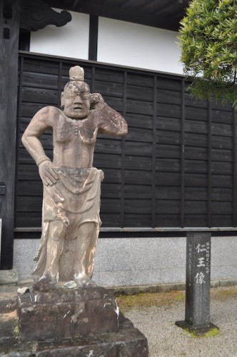 A unique stone deity statue at the temple