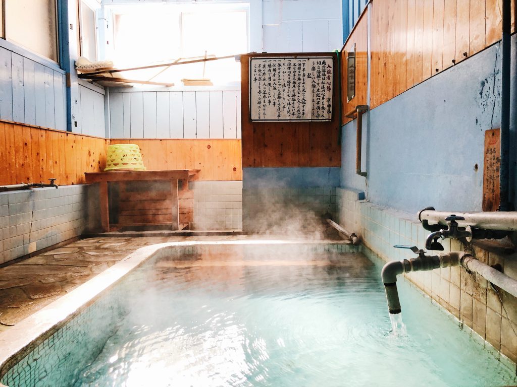 An onsen with water steam in Kumamoto